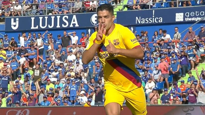 Luis Suarez celebrating after scoring goal