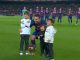 Lionel Messi posing for photographs with Ballon d'Or and children before Barcelona vs RCD Mallorca match