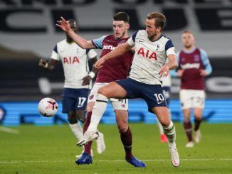 Declan Rice of West Ham battles with Harry Kane of Tottenham Hotspur-remier League