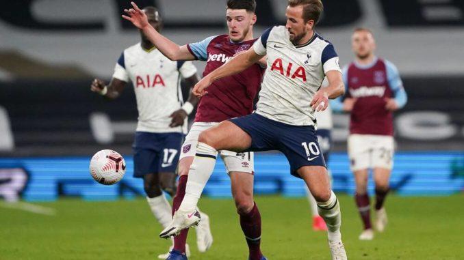 Declan Rice of West Ham battles with Harry Kane of Tottenham Hotspur-remier League