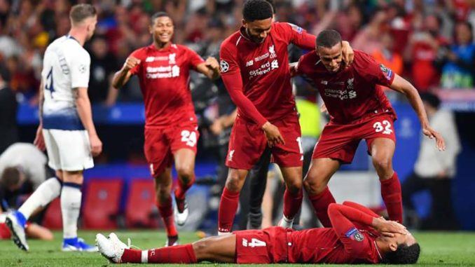 Joe Gomez, Joel Matip and Virgil van Dijk of Liverpool celebrate winning the UEFA Champions League final against Tottenham
