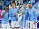 Raheem Sterling-John Stones-Kevin De Bruyne-Kyle Walker pose with the Premier League trophy at the Etihad Stadium