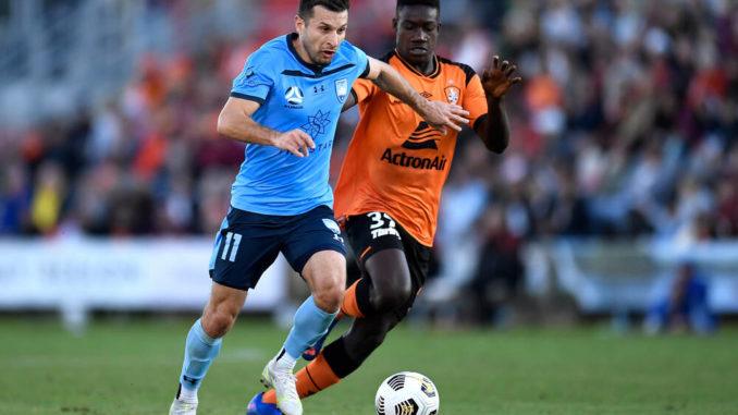 Kosta Barbarouses of Sydney FC-Cyrus Dehmie of Brisbane Roar