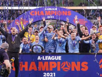 Melbourne City captain Scott Jamieson, Patrick Kisnorbo, with Championship trophy after winning A-League Grand Final