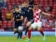 Scott McTominay of Scotland and Ivan Perisic of Croatia