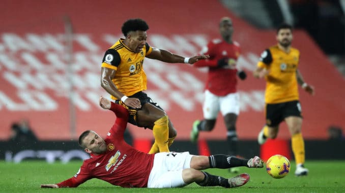 Adama Traore of Wolves and Luke Shaw of Manchester United in Premier League