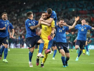 Italy players celebrate with goalkeeper Gianluigi Donnarumma