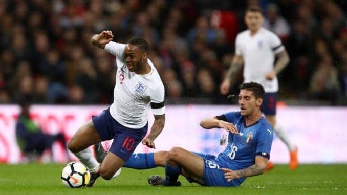 Raheem Sterling of England and Lorenzo Pellegrini of Italy