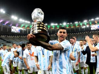 Cristian Romero of Argentina lift the Conmebol Copa America Trophy