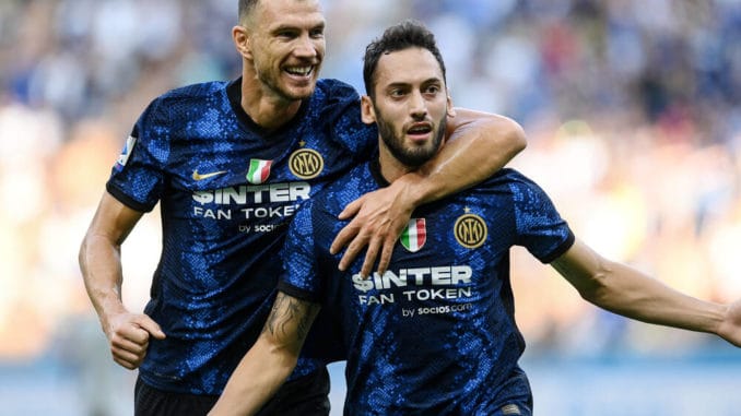 Hakan Calhanoglu and Edin Dzeko of Inter Milan against Genoa
