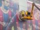 Lionel Messi's photo seen being removed from a poster at the Camp Nou