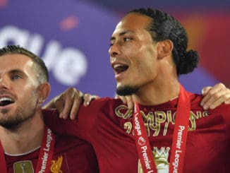Liverpool s Virgil van Dijk and Jordan Henderson following the trophy presentation at Anfield
