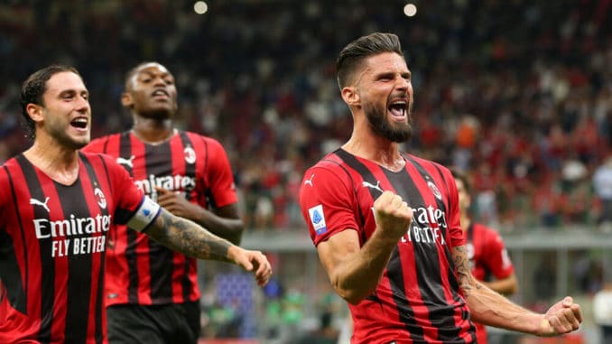 Olivier Giroud celebrates after scoring the penalty for AC Milan against Cagliari