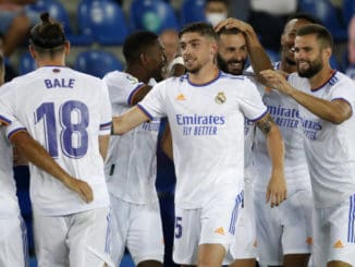 Real Madrid's Karim Benzema celebrates with team mates after scoring against Alaves