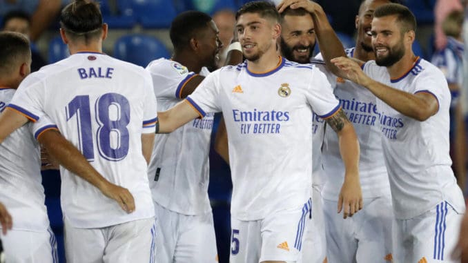 Real Madrid's Karim Benzema celebrates with team mates after scoring against Alaves