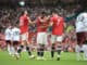 Bruno Fernandes of Manchester United is consoled by Edinson Cavani and Cristiano Ronaldo