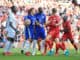 Cesar Azpilicueta and Romelu Lukaku of Chelsea step in as Jordan Henderson of Liverpool confronts Chelsea goalkeeper Edouard Mendy