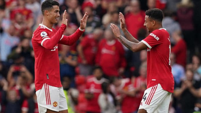 Cristiano Ronaldo and Jesse Lingard celebrate victory during the Premier League match at Old Trafford