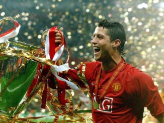 Cristiano Ronaldo of Manchester United, parades with the Champions League trophy in 2008