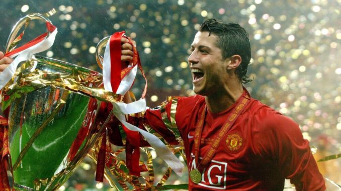 Cristiano Ronaldo of Manchester United, parades with the Champions League trophy in 2008