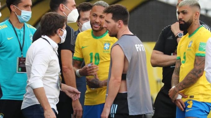 Lionel Messi speaks with Neymar Jr after Brazilian health officials stopped Brazil-Argentina World Cup qualifiers