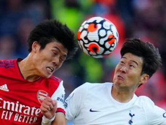 Takehiro Tomiyasu of Arsenal battles with Son Heung-Min of Tottenham Hotspur