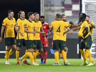 Awer Mabil (2nd R) of Australia celebrates with teammates against Oman