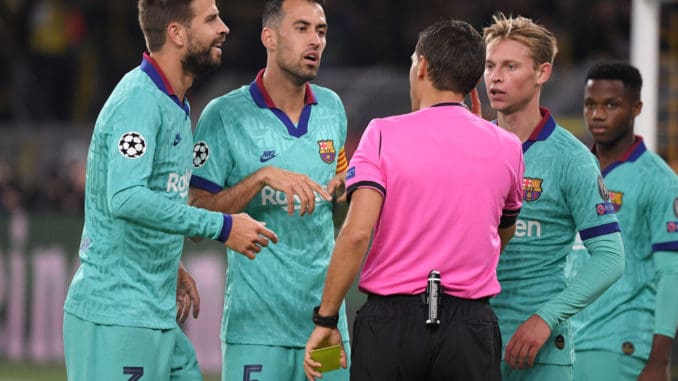 Gerard Pique, Sergio Busquets, Frenkie de Jong and Ansu Fati of FC Barcelona with Referee Ovidiu Hategan