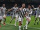 Paulo Dybala of Juventus celebrates with team mates