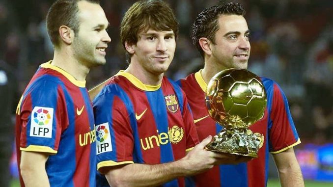 Andres Iniesta of FC Barcelona with Lionel Messi and Xavi Hernandez