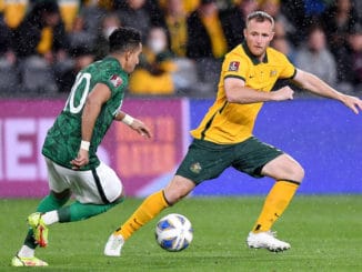 Salem Aldawsari of Saudi Arabia competes for possession with Rhyan Grant of the Socceroos