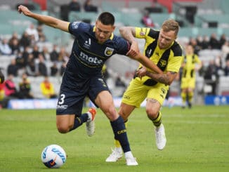 Lewis Miller of the Central Coast Mariners and David Ball of the Wellington Phoenix compete for the ball
