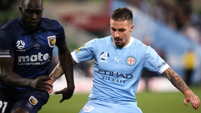 Jamie Maclaren of Melbourne City and Ruon Tongyik of the Central Coast Mariners