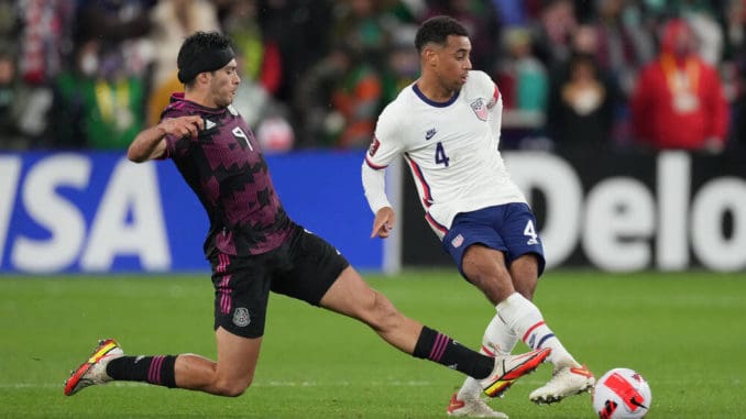Mexico forward Raul Jimenez (9) battles with United States midfielder Tyler Adams