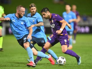 Osama Malik of the Glory comes under pressure from Luke Brattan and Rhyan Grant of Sydney FC