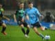 Max Burgess of Sydney FC crosses the ball into the Western United penalty area