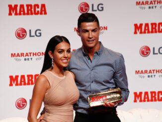 Cristiano Ronaldo and girfriend, Georgina Rodriguez, while he receives the award from MARCA