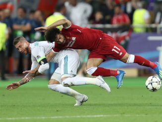 Mohamed Salah gets injury after tough tackle by Sergio Ramos. UEFA Champions League final Real Madrid - Liverpool. Olympic NSC stadium